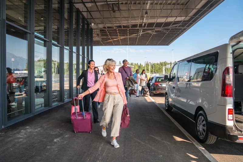 A group loading a passenger van