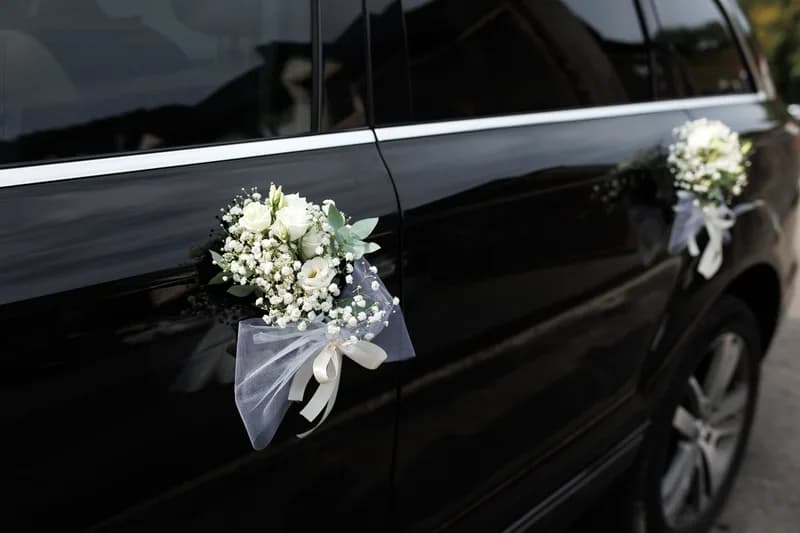 A luxury wedding car outside an elegant venue