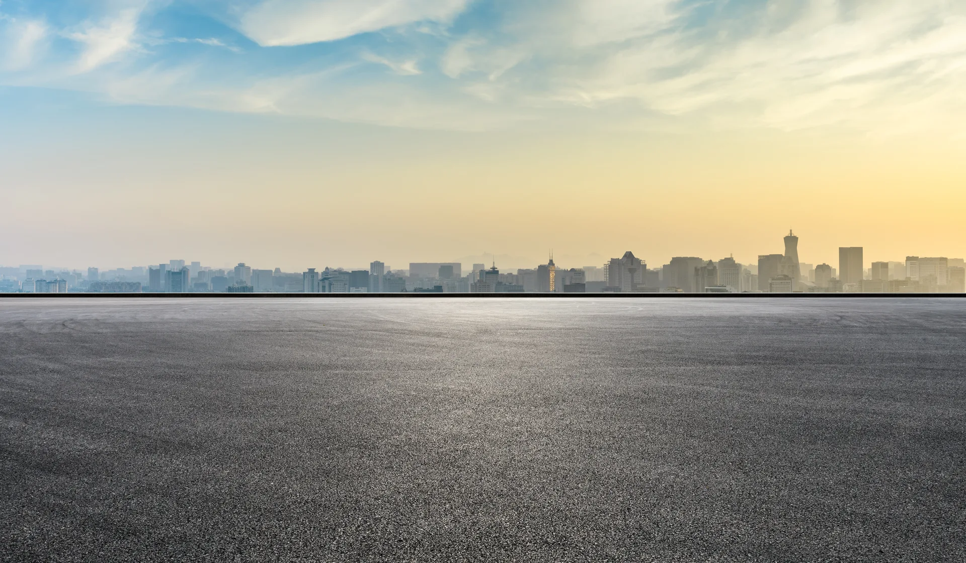 An open highway at sunrise for an early-morning airport transfer