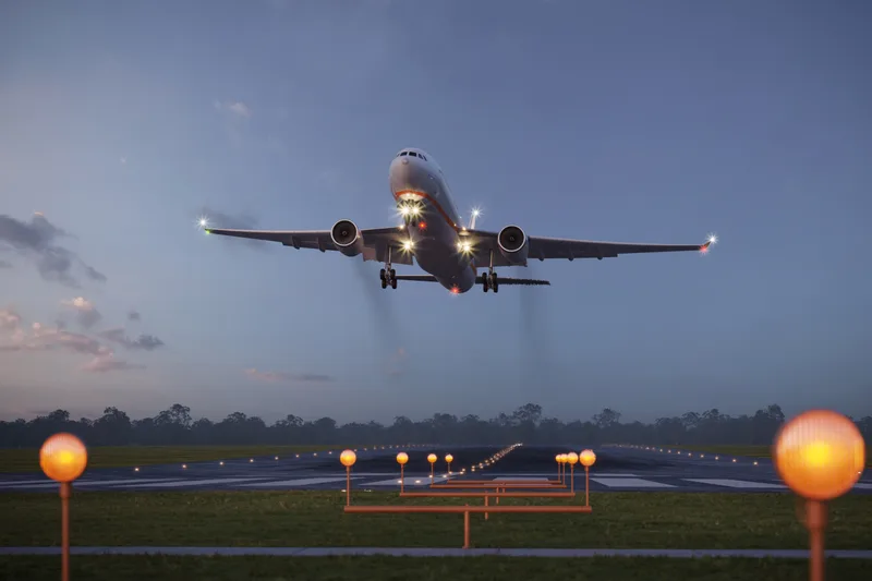 An aircraft on the runway at dusk near Hamilton's John C. Munro airport