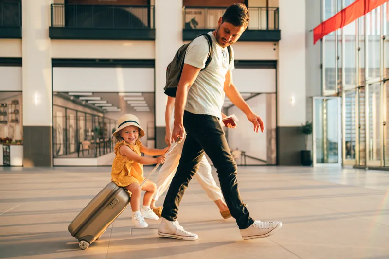 A family with children heading to the airport