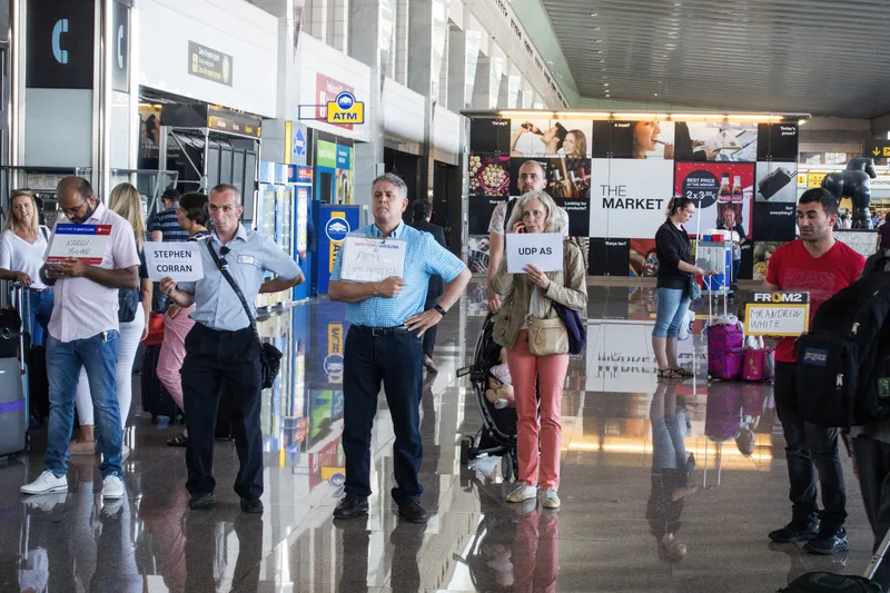 A chauffeur meeting a traveller at arrivals