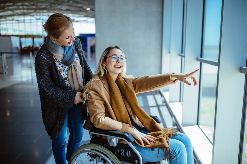 A senior traveller being assisted at the airport